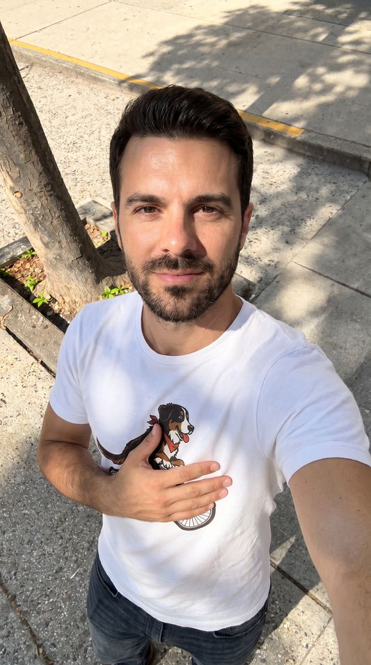 Person wearing the Bernese Mountain Dog on a Bike unisex t-shirt outdoors