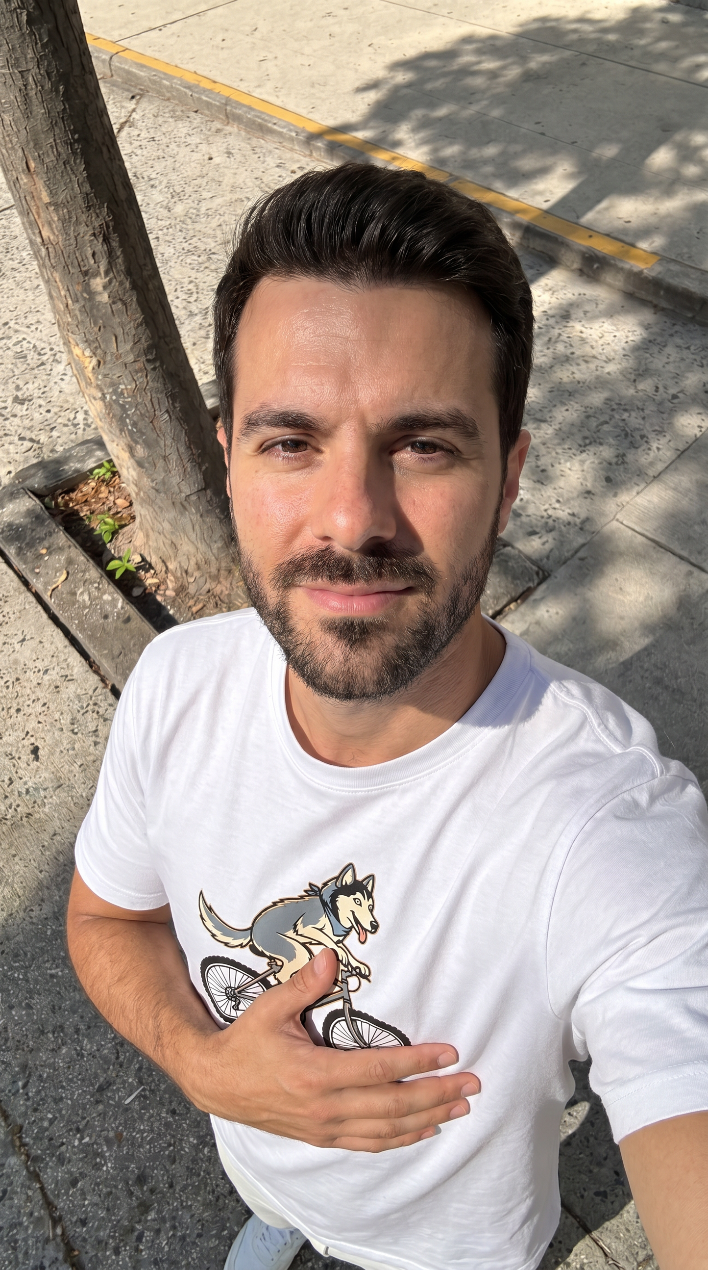 Person wearing the Husky on a Bike unisex t-shirt outdoors